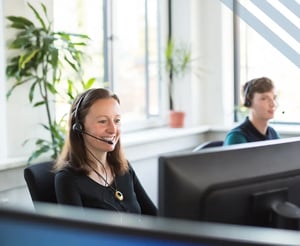 claims specialists smile as they help customers
