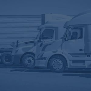 Semi trucks parked at a truck stop
