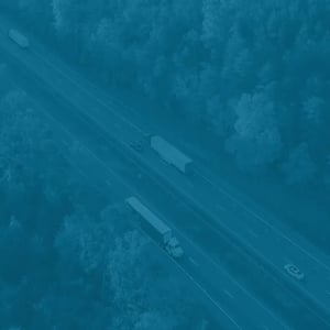 Aerial shot of a commercial truck driving on a highway