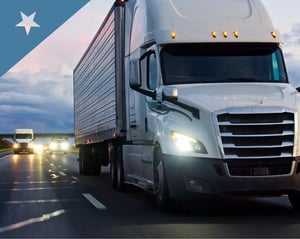 angled shot of a truck driving along the highway