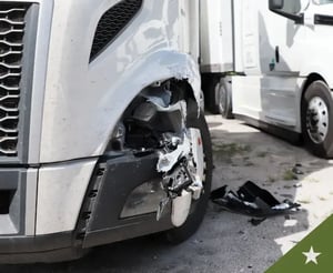 Damaged semi truck sitting in a lot