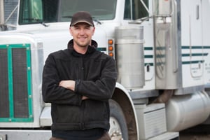 Male-truck-driver-standing-in-front-of-his-truck-3