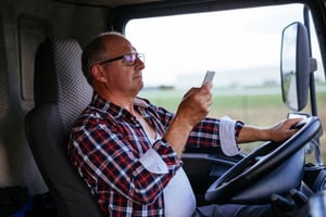 Truck-Driver-Looking-At-Phone-While-Driving-3