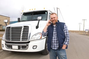 Truck-driver-oustide-of-semi-on-phone -3